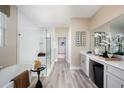 Luxurious bathroom with soaking tub, glass shower, and vanity offers a spa-like retreat within your home at 12180 Cattleside Dr, Riverview, FL 33579