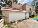 Spacious garage offering ample parking and storage space, ensuring convenience for homeowners at 16006 Armistead Ln, Odessa, FL 33556