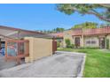 The property features covered parking adjacent to the front of the house with a charming terracotta tile roof at 1701 Pinehurst Rd # 33E, Dunedin, FL 34698