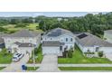 Eye-catching home with solar panels, lush landscaping, and a well-kept lawn in a quiet neighborhood at 2073 Branding Iron Way, New Port Richey, FL 34655