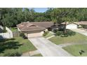 Lovely single-story home with a neatly kept lawn and two car garage in a quiet neighborhood at 2532 Sweetgum W Way, Clearwater, FL 33761