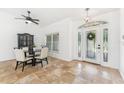 Welcoming entryway featuring neutral tile flooring, and a decorative front door at 3509 Country Creek Ln, Valrico, FL 33596
