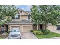 Charming two-story home with a well-manicured lawn, brick-paved driveway, and attached two-car garage at 3918 Silverlake Way, Wesley Chapel, FL 33544