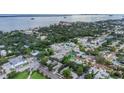 Beautiful aerial view of property showcasing the surrounding neighborhood and waterfront location at 411 Locklie St, Dunedin, FL 34698