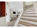 Bright staircase with hardwood treads and white risers leading to the next floor at 4322 Fincastle Ct, Tampa, FL 33624