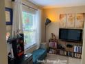 Comfortable bonus room setup with a view, modern décor and a well-lit atmosphere at 5139 Corvette Dr, Tampa, FL 33624