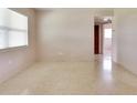Bright living room with a view to other rooms and light terrazzo flooring at 5221 48Th N Ave, St Petersburg, FL 33709
