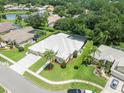 Spacious home with a pool and gorgeous landscaped yard, surrounded by lush trees at 6905 Arabian Rd, Odessa, FL 33556