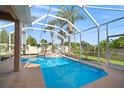 Relaxing screened-in pool area with a hot tub and plenty of space for outdoor lounging and entertaining at 10101 Paddock Oaks Dr, Riverview, FL 33569