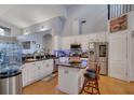 Bright kitchen with stainless steel appliances, granite countertops, and a kitchen island with bar stool seating at 10327 Meadow Crossing Dr, Tampa, FL 33647