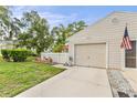 A well-maintained home with an attached garage, and landscaping at 12529 Knollbrook Ln, Hudson, FL 34669