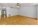 Open living room featuring neutral walls and hardwood flooring at 1902 Elaine Dr, Clearwater, FL 33760