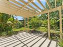 Relaxing backyard featuring a cozy patio and garden, ideal for outdoor enjoyment at 2068 Diane Ave, Palm Harbor, FL 34683
