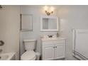 Well-lit bathroom featuring a modern vanity, updated fixtures, and a window with blinds at 2926 Fairfield S Ave, St Petersburg, FL 33712