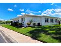 Well-maintained home featuring white siding, a newer roof, and mature landscaping at 3605 100Th N Ter, Pinellas Park, FL 33782