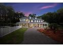Charming multi-story home with inviting porch and landscaped yard at 3663 Berger Rd, Lutz, FL 33548