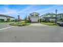 Charming two-story home with attached two-car garage and manicured front lawn at 4608 Emprise Way, Land O Lakes, FL 34638