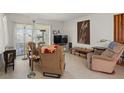 A casual living room with two plush armchairs and natural light at 5391 54Th N St, St Petersburg, FL 33709