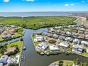 Scenic aerial view of a waterfront community with luxurious homes, canals, and stunning waterfront vistas at 718 Pinckney Dr, Apollo Beach, FL 33572