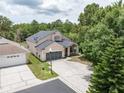 Inviting two-story home with well-maintained landscaping and a spacious driveway at 8050 Diablo Ct, Trinity, FL 34655