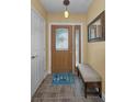 Welcoming entryway featuring decorative glass door, neutral paint, and tile flooring at 11236 116Th St, Largo, FL 33778