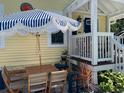 Quaint outdoor seating area with a stylish umbrella, perfect for relaxing and enjoying the outdoors at 1137 Highland S St, St Petersburg, FL 33701