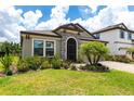 Charming single-story home with manicured lawn and stone accents at 12646 Oak Hill Way, Parrish, FL 34219