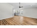 Bright living area featuring sleek flooring and an open layout for flexible living at 19267 Wildwood Dr, Brooksville, FL 34601