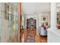 Elegant living room featuring hardwood floors, a bookshelf, and abundant natural light at 2404 W Jetton Ave, Tampa, FL 33629