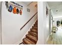 Staircase with wood-look steps and a decorative 