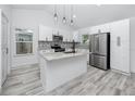 Modern kitchen with granite countertops, stainless steel appliances, and stylish backsplash at 2859 38Th N Ave, St Petersburg, FL 33713