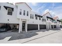 Contemporary townhomes feature black awnings, terra cotta roofs and attached garages at 3210 W Horatio St # 9, Tampa, FL 33609