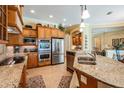 Gourmet kitchen features stainless steel appliances, granite countertops, and custom cabinetry at 33744 Americana Ave, Dade City, FL 33525