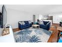 Cozy living room with comfortable seating, stylish rug and an open floor plan at 4050 4Th N St # 116, St Petersburg, FL 33703