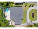 Aerial view of property showcasing roof, driveway, pool, and backyard at 521 51St S Ave, St Petersburg, FL 33705