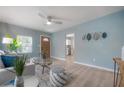 Inviting living room with wood flooring, modern decor, and plenty of natural light for a relaxing atmosphere at 811 W Peninsular St, Tampa, FL 33603