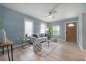 Comfortable living room features bright walls, wood floors, and modern furnishings with great natural light at 811 W Peninsular St, Tampa, FL 33603
