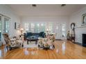 Bright living room with hardwood floors, fireplace, and plenty of natural light at 842 S Boulevard, Tampa, FL 33606