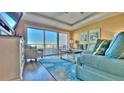 Comfortable living room area that opens to a balcony with views at 100 Bayside Dr # 202, Clearwater Beach, FL 33767