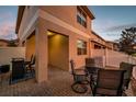 Rear patio with outdoor seating and brick pavers, perfect for relaxing and entertaining at 12025 Greengate Dr, Hudson, FL 34669