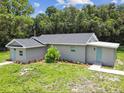 Beautifully renovated single-Gathering home featuring a new roof, fresh landscaping, and inviting entrance at 2812 Tom Brewer Ln, Plant City, FL 33566
