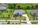 An aerial view showcasing the home, surrounding properties, and lush green landscape at 2839 Cordoba Ranch Blvd, Lutz, FL 33559