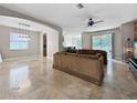 Spacious living room with tile flooring, neutral paint, and an open floor plan at 4079 Pacente Loop, Wesley Chapel, FL 33543