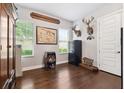 Office with hardwood floors, two windows providing natural light, and custom decorations at 6007 Quartz Lake Way, Lithia, FL 33547