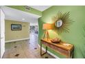 Inviting entryway with decor, modern flooring, and light, open space leading into the main living area at 6600 Sunset Way # 118, St Pete Beach, FL 33706