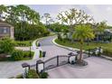 The gated community entrance offers security and manicured landscaping, with tree-lined streets and sidewalks at 7849 Marsh Pointe Dr, Tampa, FL 33635