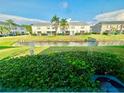 Scenic backyard view with a tranquil canal and lush greenery, providing a serene and private outdoor space at 12249 Country White Cir, Tampa, FL 33635
