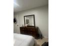 Bedroom featuring a dresser with a mirror at 1421 Mohrlake Dr, Brandon, FL 33511