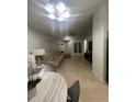 Bright living room featuring tile floors, neutral paint, and a ceiling fan at 1421 Mohrlake Dr, Brandon, FL 33511