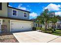 Two car garage and nicely landscaped front yard at 2155 Cerulean Sky Dr, Lutz, FL 33558